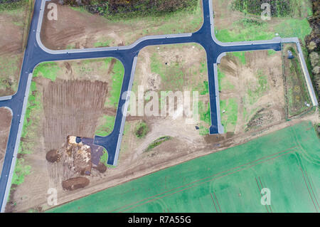 Aerial view of road streets guidelines new development area for real estate mome building arable area green Germany.