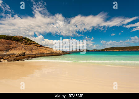 A wide-angle shot of the beach, rocks and blue sky of Hellfire Bay in Western Australia. Stock Photo
