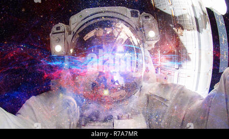 Astronaut in outer space. Elements of this image furnished by NASA. Stock Photo