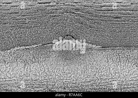 Abstract frost patterns on a wooden rail Stock Photo