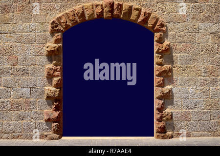 Door in the ancient stone wall white isolated. copy space for an inscription in an arch on a wall of sandstone. Stock Photo