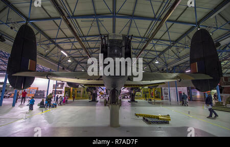 RAF Museum, London, UK. 8 December, 2018. To celebrate 100 years since the formation of the RAF, RAF Museum London offer visitors the last chance to get a closer look inside 14 cockpits and vehicles from the RAF Museum collection including a Hawker Hurricane, Hawker Typhoon, Liberator, Stuka and Bristol Beaufort. Visitors walk around the iconic Avro Lancaster (not included in the cockpit event). Credit: Malcolm Park/Alamy Live News. Stock Photo