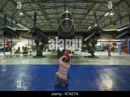 RAF Museum, London, UK. 8 December, 2018. To celebrate 100 years since the formation of the RAF, RAF Museum London offer visitors the last chance to get a closer look inside 14 cockpits and vehicles from the RAF Museum collection including a Hawker Hurricane, Hawker Typhoon, Liberator, Stuka and Bristol Beaufort. Visitors walk around and admire the iconic Avro Lancaster (not included in the cockpit event). Credit: Malcolm Park/Alamy Live News. Stock Photo