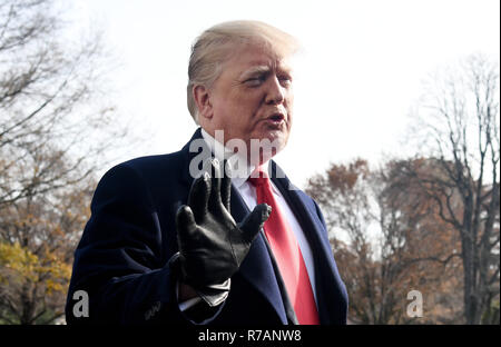 Washigton, USA. 8th Dec 2018. United States President Donald J. Trump answers questions from the press while departing the White House December 8, 2018 in Washington, DC. Trump announced White House Chief of Staff John Kelly will resign by the end of the year before departing for the 119th Army-Navy Football Game in Philadelphia, Pennsylvania Credit: Olivier Douliery/CNP/ZUMA Wire/Alamy Live News