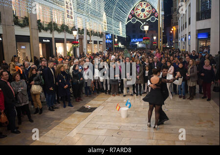 Malaga, Spain. 8th Dec 2018. A couple of tango dancers performing on the street during the christmas season at Marques de Larios street. Credit: SOPA Images Limited/Alamy Live News Stock Photo