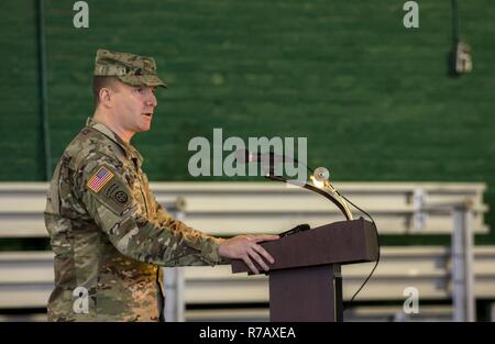 U.S. Army Maj. Ian Seagriff speaks after assuming command of the 101st Expeditionary Signal Battalion, New York Army National Guard, from outgoing commander Lt. Col. Diane Armbruster at the Police Athletic League Center, Yonkers, N.Y., April 9, 2017. Stock Photo