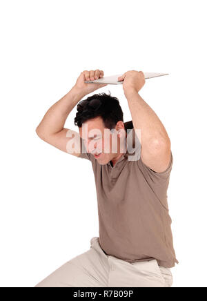 Angry man likes to throw his laptop away Stock Photo
