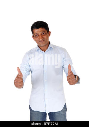 Handsome man standing with two thumps up Stock Photo