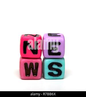 news - word made from multicolored child toy cubes with letters Stock Photo
