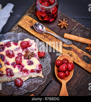 baked pie from cottage cheese and cherries on a glass plate Stock Photo
