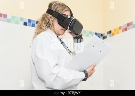 Scientist with clipboard using virtual reality glasses for research in laboratory Stock Photo