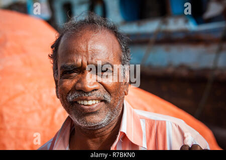 Market trader shop keeper in the souk Dubai, UAE Stock Photo