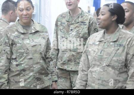 The Adjutant General for the Maryland National Guard, Maj. Gen. Linda Singh, receives an orientation briefing of the 29th Combat Aviation Brigade’s Battalion Aid Station by 1st Lt. Katrina Mayes on April 27, 2017 at Camp Buehring, Kuwait. This visit allowed Maryland National Guard leaders to gain a better understanding of medical support provided to Soldiers of the 29th CAB during their deployment to Kuwait. Stock Photo