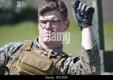A U.S. Marine Corps range tower NCO assesses wind conditions at Altcar ...