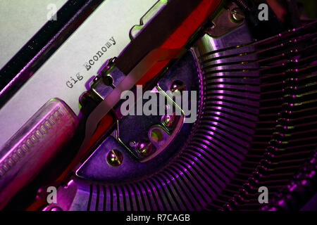 Vintage typewriter with the words gig economy printed on a letter Stock Photo