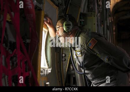 A Loadmaster From The West Virginia Air National Guard Marshals In A