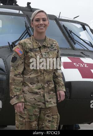 Chief Warrant Officer 2 Megan Yanacek of the Pennsylvania National Guard piloted a UH-60 Black Hawk helicopter to the 911th Airlift Wing in Coraopolis, Pennsylvania, for the 2017 Wings Over Pittsburgh Air Show on May 13-14, 2017.  Yanacek completed flight school in 2012 after having spent eight years in the National Guard as a combat medic. Stock Photo