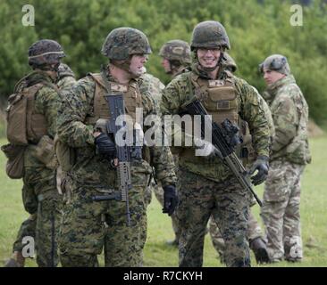 A U.S. Marine Corps range tower NCO assesses wind conditions at Altcar ...