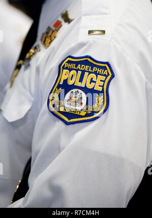 The Philadelphia Police Department, Philadelphia, Pa., patch is worn on the uniform of Lieutenant Austin Fraser, Philadelphia Police Department Firearms Training Unit, May 11, 2017, at Dover Air Force Base, Del. Fraser and 14 other members from the police department toured the Ravens section of the 436th Security Forces Squadron that included a Redman suit training demonstration, and a display of weapons used by Ravens. Stock Photo