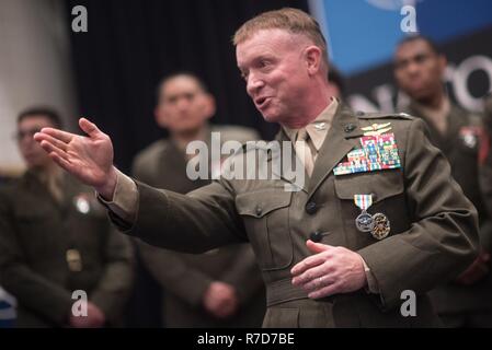 U.S. Marine Col. Philippe ‘Boz’ Rogers, U.S. Military Delegation to the North Atlantic Treaty Organization (NATO) Chief of Staff, thanks co-workers after an award ceremony   during at NATO Headquarters, May 17, 2017. Rogers was awarded the Defense Superior Service Medal. (DoD Stock Photo