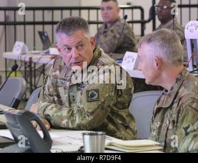Maj. Gen. Janson D. Boyles, the adjutant general of the Mississippi,  and Col. Guy Reedy, 184th Sustainment Command chief of staff, discuss topics during a briefing while on Boyles visited the deploying unit at Fort Hood, Texas. Stock Photo