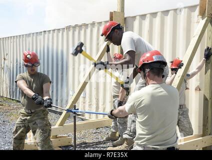 Soldiers with the 228th Engineer Company, Pennsylvania National Guard, honed their disaster response skills at Fort Indiantown Gap's structure collapse site April 11, 2017. The Soldiers, part of the Chemical, Biological, Radiological, Nuclear and Enhanced Conventional Weapons Task Force search and extraction section, used their specialized construction skills to build a frame that would be used in search and extraction operations during a large-scale disaster. Stock Photo