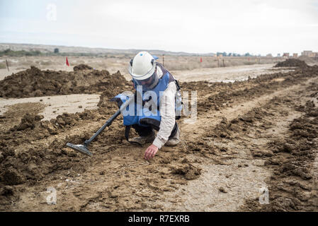 Jericho, Palestine. Autonomous Areas. 09th Dec, 2018. An Israeli worker searches for mines in the area of Qasr al-Yahud 'Castle of the Jews', the third highest holy place in Christianity, considered the baptismal site of Jesus Christ. Clearing work by the international anti-mine charity Halo Trust and the Israeli authorities in the region continues to clear landmines around seven old churches abandoned on the west bank of the Jordan, south of Jericho, since the 1967 Six-Day War. Credit: Ilia Yefimovich/dpa/Alamy Live News Stock Photo