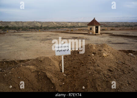 Jericho, Palestine. Autonomous Areas. 09th Dec, 2018. View over the land of the monasteries in Qasr al-Yahud 'Castle of the Jews', the third highest holy place in Christianity, which is believed to be the baptism site of Jesus Christ, and a sign 'Cleared ground'. Clearing work by the international anti-mine charity Halo Trust and the Israeli authorities in the region continues to clear landmines around seven old churches abandoned on the west bank of the Jordan, south of Jericho, since the 1967 Six-Day War. Credit: Ilia Yefimovich/dpa/Alamy Live News Stock Photo