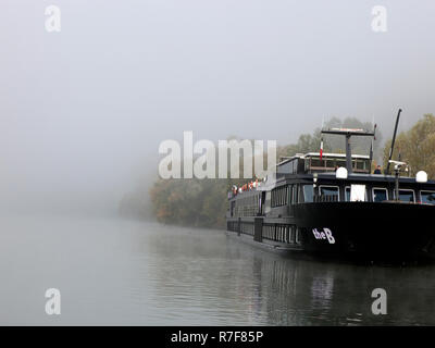 The B cruiseship on the River Seine in the morning mist Stock Photo