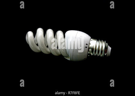 energy saving new lightbulb on black background Stock Photo