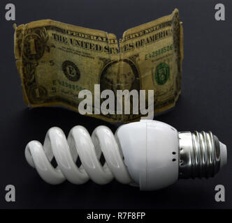 energy saving new lightbulb on black background Stock Photo