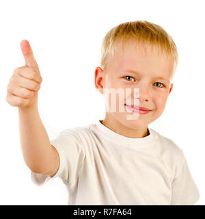 little boy with thumbs up isolated on a white background Stock Photo