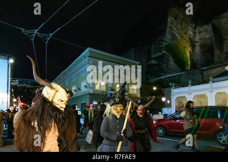 Salzburg: Krampuslauf (Krampus-Lauf, Perchtenlauf, Krampus run, mask procession) in Old Town at square Herbert-von-Karajan-Platz in Flachgau, Salzburg Stock Photo