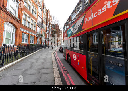A red London bus at No.1 The Mansions, London. UK Stock Photo