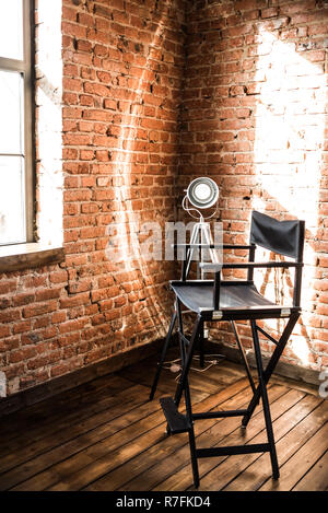 Director's chair. reflector lamp light from window, solar. Stock Photo