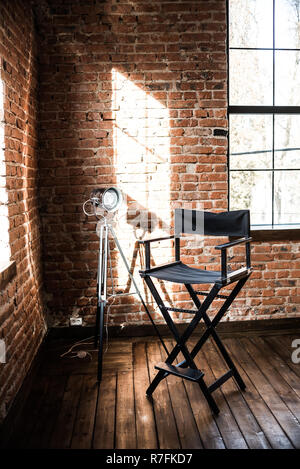 Director's chair. reflector lamp light from window, solar. Stock Photo