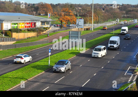 Traffic driving on a dual carriageway road A27 highway in West Sussex ...