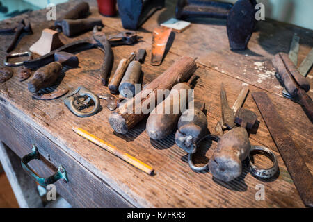 Detail of the wooden counter of a shoemaker. Stock Photo