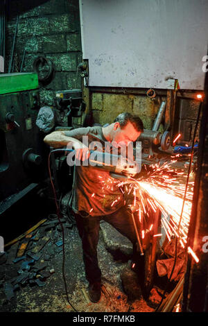 Blacksmith on the grinder Stock Photo