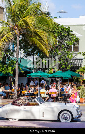 Miami Beach Florida,historic architecture,Ocean Drive,Jaguar convertible,classic,sports car cars,SK 140,1956,roadster,News Cafe,restaurant restaurants Stock Photo