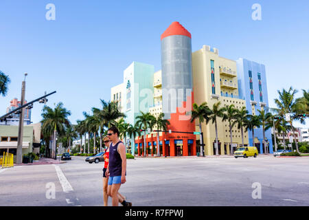 Miami Beach Florida,Washington Avenue,5th Fifth Street,intersection,corner,adult adults man men male,woman women female lady,couple,crossing street,li Stock Photo