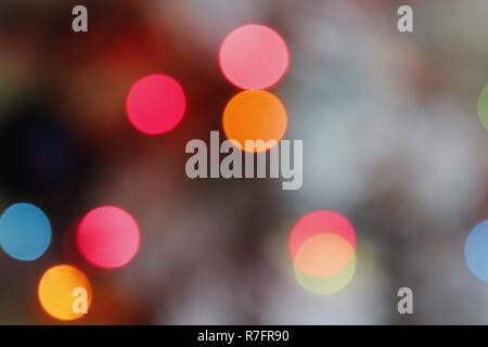 Christmas bokeh, colorful out of focus lights on a Christmas tree. Stock Photo