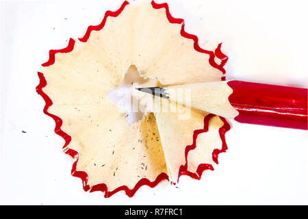 wooden pencil, pencil shavings and sharpener on white Stock Photo