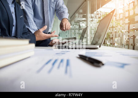 Business adviser analyzing financial figures denoting the progress in the work of the company. Stock Photo