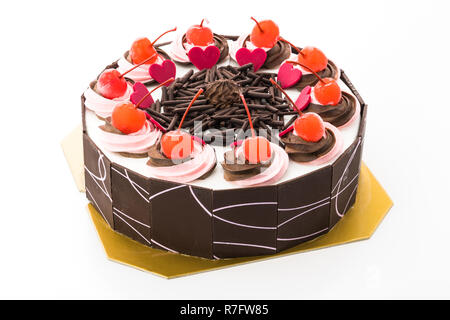 Chocolate cake with cherry on top isolated on white background Stock Photo