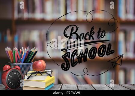 Digital composite of School materials and apple with back to school text and library background Stock Photo