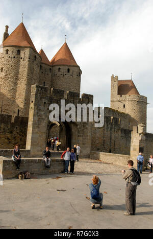 The main gates leading into the castle at Carcassonne. It is a French historical hilltop town with its medieval fortified castle complete with narrow Stock Photo