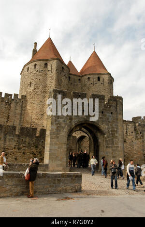 The main gates leading into the castle at Carcassonne. It is a French historical hilltop town with its medieval fortified castle complete with narrow Stock Photo