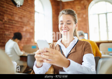 Messaging in office Stock Photo