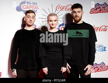 Clean Bandit's Luke Patterson, Grace Chatto and Jack Patterson (left-right) on the media run during day two of Capital's Jingle Bell Ball with Coca-Cola at London's O2 Arena. Stock Photo